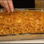 Topping casserole with fried onions