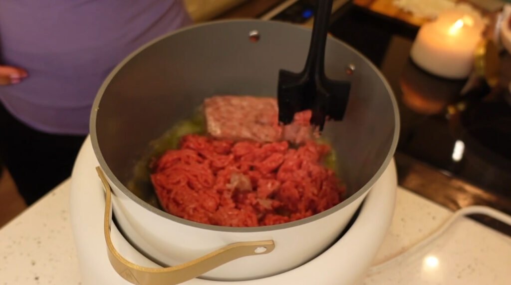 Ground beef and sausage in pot